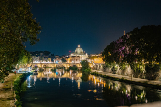 Rome, Italy August, 7th, 2021. Night view of St Angelo bridge and St. Peter's Basilica in the Vatican, Rome, Italy