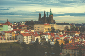 Obraz premium Colorful cityscape roofs. Castle Saint Vitus Cathedral on the background. Prague, Czech Republic. Vintage toned image.