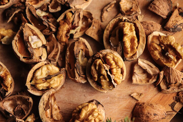 cracked nuts, peeled walnuts, wooden backgorund, organic fruit, healthy