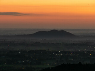 Amazing Sunrise Over Misty Landscape. Scenic View Of Foggy Morning Sky With Rising Sun Above Misty Forest