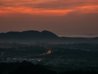 Amazing Sunrise Over Misty Landscape. Scenic View Of Foggy Morning Sky With Rising Sun Above Misty Forest