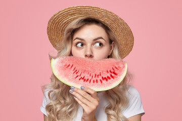 Woman with watermelon slice in studio