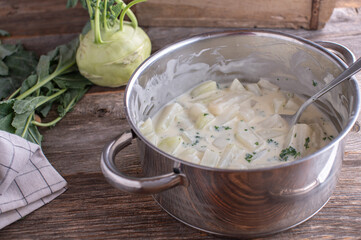 Vegetable with bechamel sauce made with cooked kohlrabi and served in a pot