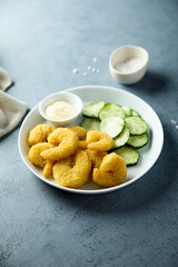 Deep fried shrimps with cucumber salad