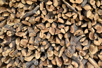 Dry firewood stacked outdoors