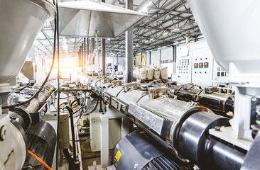 Workshop with extruders for producing plastic pipes. High speed extrusion line of water suppply and...