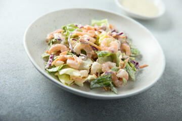 Green salad with shrimps and mayo dressing