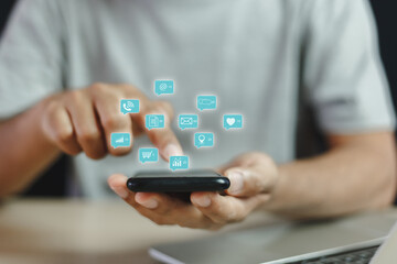 man touching mobile phone or smartphone with notification social media icons, email, shopping, telephone, internet social communication online. Digital marketing concept.