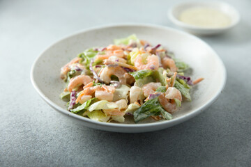 Green salad with shrimps and mayo dressing
