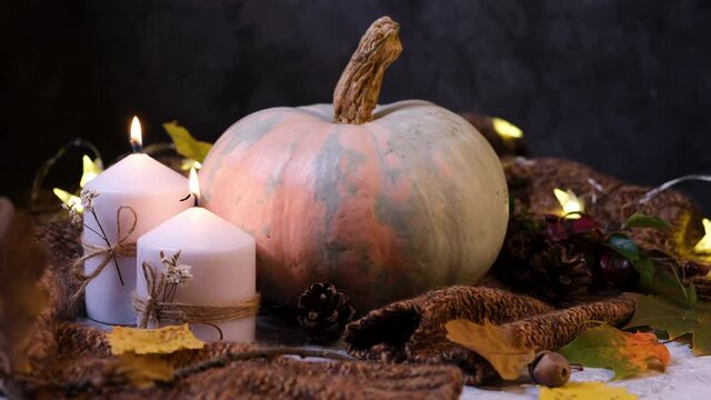 Thanksgiving concept autumn composition with pumpkin and burning candles
