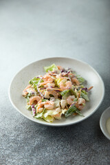 Green salad with shrimps and mayo dressing