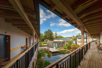 Fototapeta na wymiar View from terrace of modern hotel with garden pond