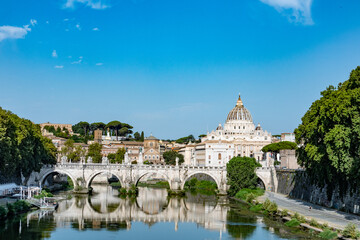 Rome, Italy August, 8th, 2021. View of St Angelo bridge and St. Peter's Basilica in the Vatican, Rome, Italy