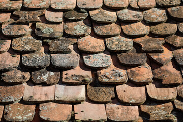 Shallow depth of field (selective focus) details of Transylvanian saxon traditional clay tiles.