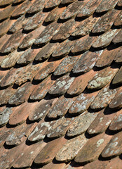 Shallow depth of field (selective focus) details of Transylvanian saxon traditional clay tiles.