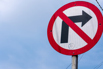 don't turn right city traffic sign under the sunlight and clear blue sky