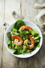 Homemade Caesar salad with shrimps
