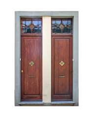 Double entrance front doors isolated on white. Colorful classic ancient wooden streetdoor with windows in the wall.