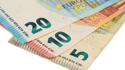 Close-up of five, ten and twenty euro bills.