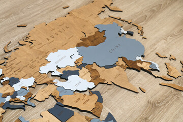 Wooden world map on thr wall. Geography concept. Background for travel. Logistics and...