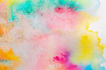 Light colorful watercolor stains. Abstract painted background on white paper