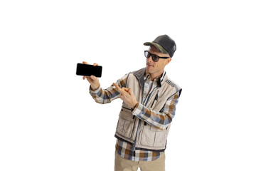 Portrait of young man wearing sport style clothes using phone isolated over white studio background