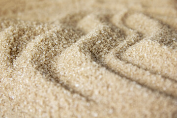 Sand beach with texture and waves