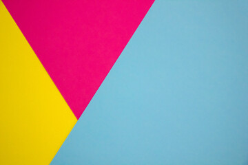 Blue, yellow and pink paper color for background. Geometric pattern, minimalism texture shapes