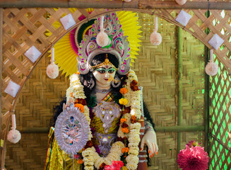 Fototapeta na wymiar idol of hindu goddess saraswati being worshipped during saraswati puja festival in bengal.