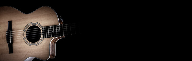 Acoustic guitar and blank black background - obrazy, fototapety, plakaty