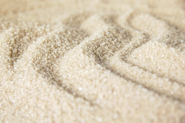 White sand beach with texture and waves. Background