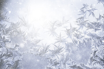 Fototapeta na wymiar frost patterns on window glass, abstract background winter rime snow