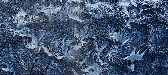frost patterns on window glass, abstract background winter rime snow