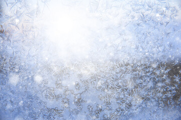 frost patterns on window glass, abstract background winter rime snow
