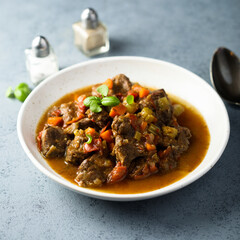 Beef ragout with vegetables and basil