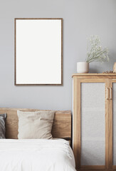 Blank picture frame mockup on gray wall. White living room design. View of modern scandinavian style interior with artwork mock up on wall. Home staging and minimalism concept © kite_rin