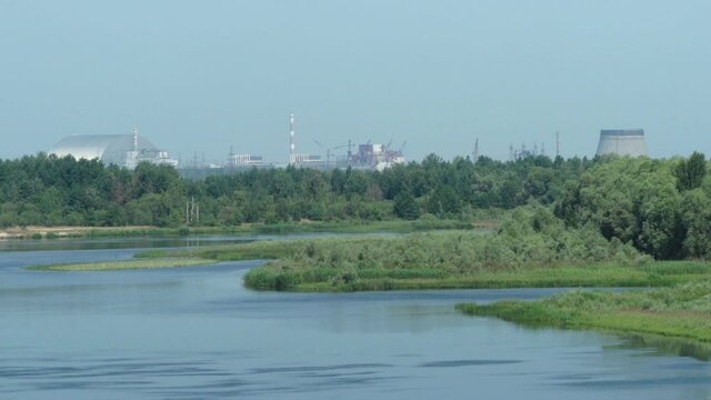 4K view of ChNPP (Chernobyl Nuclear Power Plant) from bridge over Prypiat River