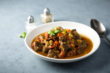 Beef ragout with vegetables and basil