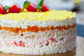 salad of mixed ingredients stacked in several layers