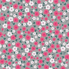Beautiful vintage pattern. Small white and pink flowers, green leaves. Gray background. Floral seamless background. An elegant template for fashionable prints.