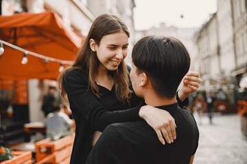 Portrait of a girl who looking at her boyfriend and smiling - obrazy, fototapety, plakaty