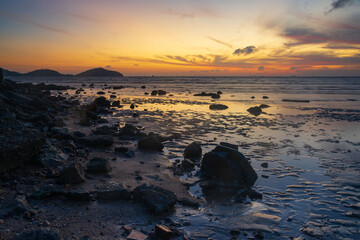 Scene of Saphanhin beach, Phuket during low tide before sunrise.