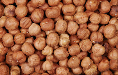 Heap of peeled hazelnuts Nuts background and texture