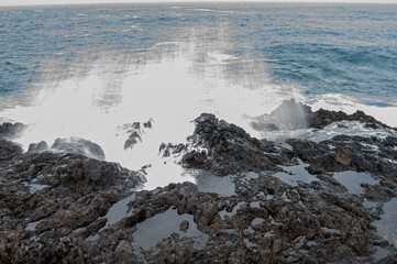 the force of the sea is shaping the volcanic rocks despite their hardness and rigidity