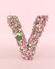 Creative letter V concept made of fresh Spring wedding flowers. Flower font concept on pastel pink background.