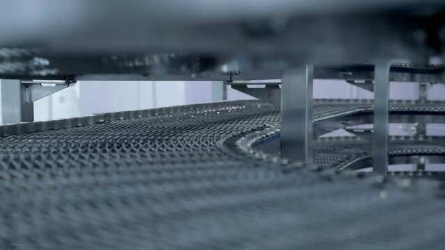 Spiral conveyor for cooling bread is designed for fast and high-quality cooling of bakery products. Shot in motion