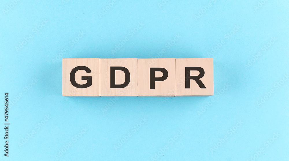 Poster wooden cube block with text gdpr on blue background