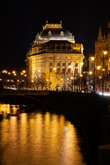 Fototapeta na wymiar Prague at night, National Theater, reflection of lights in the river