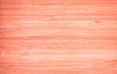 Close up of wood texture in orange color.