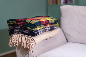 Stack of woolen checked blankets